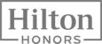 The image shows the Hilton Honors logo, featuring the word "Hilton" above "Honors" enclosed in a rectangular frame.